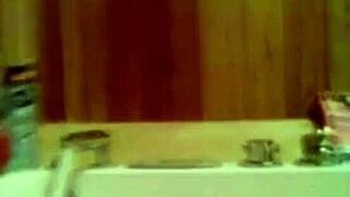 Taking a relaxing hot shower in the bathroom, enjoying the warm water and soothing steam