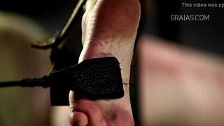 bound girl gets whipped with candle