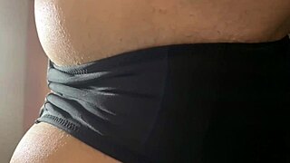 teasing model in black panties for panty fetish