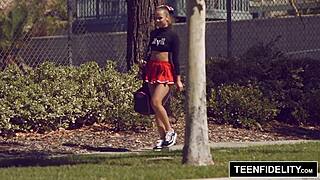 Liza Rowe shakes her pom poms cutely.