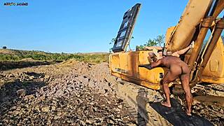 heavy machine worker abandons job for distraction with beautiful chubby babe.