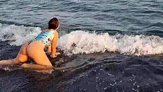 the horny teen anaduro12 shows her big ass pussy on the public beach