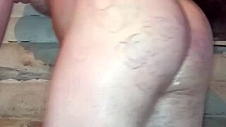 Russian gay man with painted lips inserts butter pack into ass