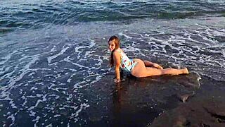 the horny teen anaduro12 shows her big ass pussy on the public beach