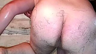 Russian gay man with painted lips inserts butter pack into ass