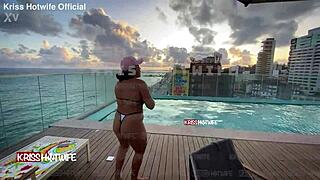 Dancing in micro bikini at hotel pool