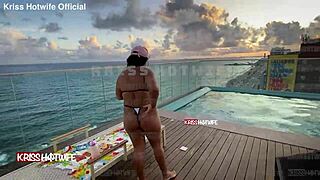 Dancing in micro bikini at hotel pool