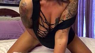 Blonde milf seduces camera with glass dildo