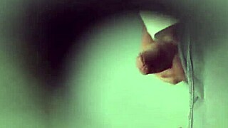 cruising with a chubby bear in public toilets, teasing his big cock, she whispers.