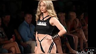 The black tape edition of the swim suit runway showcases various costumes on models.