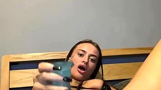A cute goth girl is playing with herself, showing her flexibility
