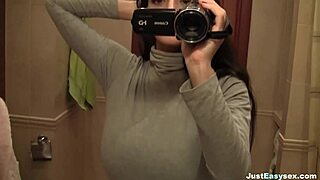 hey, busty babe fingering her hairy bush in bathroom