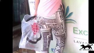 a stray cat wanders the streets while a voyeur films it