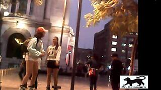 a stray cat wanders the streets while a voyeur films it