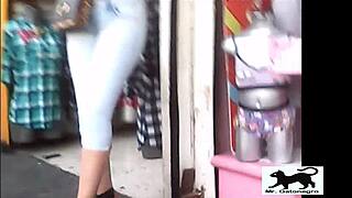 a stray cat wanders the streets while a voyeur films it