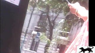 a stray cat wanders the streets while a voyeur films it