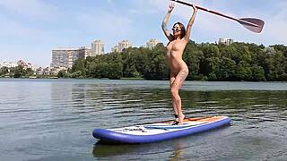 Naked beach strolls reveal a petite brunette's shaved secrets.