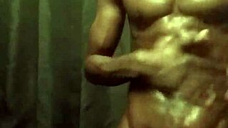 I stroke my big black cock with lots of oil