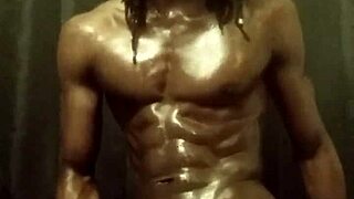 I stroke my big black cock with lots of oil