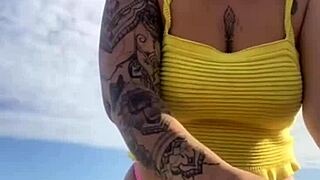 young woman flashes swollen pussy on usa beach in tight bikini