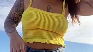 young woman flashes swollen pussy on usa beach in tight bikini