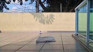 Brunette does outdoor training with shorts tucked up