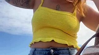 young woman flashes swollen pussy on usa beach in tight bikini