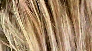 Paige wears fishnets while using a big black cock dildo.