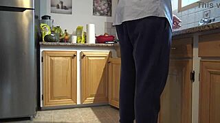 A milf performs rimjob in the kitchen with amateur assplay