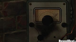 Two lesbian slaves in doggystyle position taking big strapon