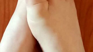 Greta Applies Nail Polish To Her Toenails