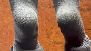 girl puts lotion on feet in fetish video