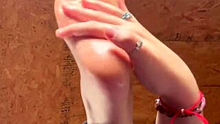 girl puts lotion on feet in fetish video