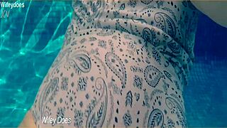 wife swimming in hotel pool one piece