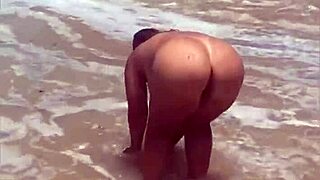 young african girl flashes on the beach exhibitionist style