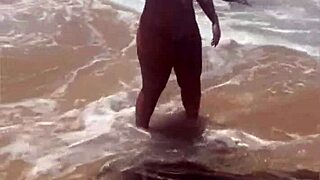 young african girl flashes on the beach exhibitionist style