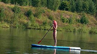 Sup and pink micro bikini in garden outdoor nature