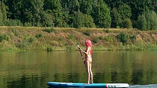 Sup and pink micro bikini in garden outdoor nature