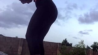 crazy bitch keeps folding clothes as she twerks in the room.