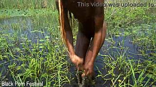 Slim African Woman Bathes In River