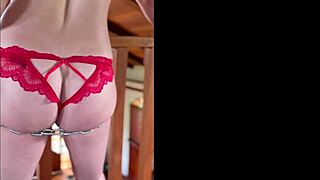 woman chained to banister in intense bondage scene