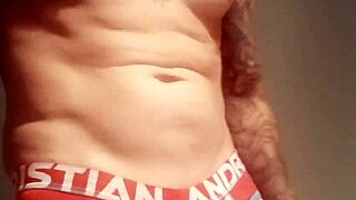 Amateur guy with blue eyes flashes his big cock in a public shower after lockup.