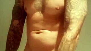 Amateur guy with blue eyes flashes his big cock in a public shower after lockup.