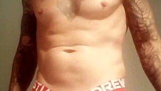 Amateur guy with blue eyes flashes his big cock in a public shower after lockup.