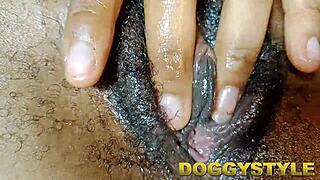 Mature woman fingers her huge pussy with dildo