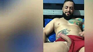 A brazilian amateur shows pierced nipples and tattoos in solo bed session.