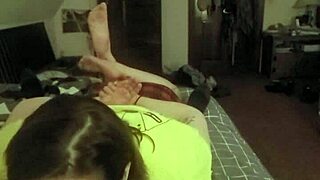 Laying on her stomach and deepthroating like a good slave