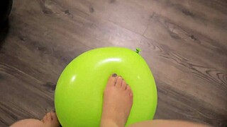 Girl pops balloons in pantyhose excitedly!