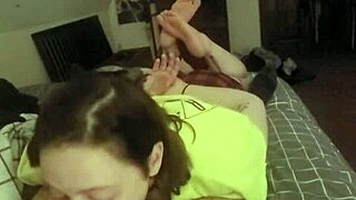 Laying on her stomach and deepthroating like a good slave