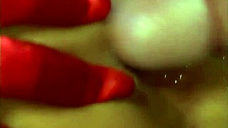 she rides his cock while wearing a pair of red satin gloves and at the end of it she.